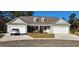 Charming home exterior featuring a two-car garage, pristine landscaping, and a welcoming entrance at Tbd Aft Ct # 101, Murrells Inlet, SC 29576