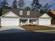 Charming single-story home with a three-car garage, dormer windows, and manicured landscaping at Tbd Aft Ct # 101, Murrells Inlet, SC 29576