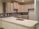 Spacious kitchen with gray cabinets, quartz countertops, and stainless steel sink and faucet at Tbd Aft Ct # 101, Murrells Inlet, SC 29576