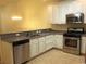 Kitchen with white cabinets, granite countertops, and stainless steel appliances at Tbd Aft Ct # 101, Murrells Inlet, SC 29576