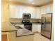 Updated kitchen with white cabinets, granite countertops, and stainless steel appliances at Tbd Aft Ct # 101, Murrells Inlet, SC 29576