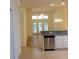 Open-concept kitchen and living area, featuring stainless steel appliances and tile flooring at Tbd Aft Ct # 101, Murrells Inlet, SC 29576