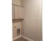 Functional laundry area with gray cabinets, utility connections, and tile flooring at Tbd Aft Ct # 101, Murrells Inlet, SC 29576
