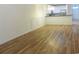 Spacious living room features hardwood flooring, wainscotting, and an open view to the kitchen at Tbd Aft Ct # 101, Murrells Inlet, SC 29576