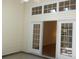 Enclosed sunroom featuring sliding glass doors, multiple windows, and a light wood floor at Tbd Aft Ct # 101, Murrells Inlet, SC 29576