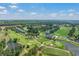 Aerial view of a community with a golf course, ponds, and an expansive view of the city at 1001 World Tour Blvd. # 203, Myrtle Beach, SC 29579