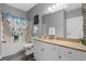 Well-lit bathroom featuring a vanity with sink, toilet, tub and shower with nautical decor at 1001 World Tour Blvd. # 203, Myrtle Beach, SC 29579