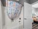 Bathroom with nautical-themed shower curtain and access to the beautifully decorated bedroom at 1001 World Tour Blvd. # 203, Myrtle Beach, SC 29579