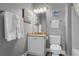 Cozy bathroom featuring a charming vanity, toilet, and mermaid-themed decorations at 1001 World Tour Blvd. # 203, Myrtle Beach, SC 29579