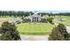 Aerial view of the community clubhouse with well-manicured lawn and circular drive at 1001 World Tour Blvd. # 203, Myrtle Beach, SC 29579