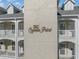 Close-up of 'The Cypress Point' sign on the building exterior, showcasing the property's name at 1001 World Tour Blvd. # 203, Myrtle Beach, SC 29579