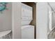 Efficient laundry area featuring a stacked washer and dryer unit inside a closet at 1001 World Tour Blvd. # 203, Myrtle Beach, SC 29579