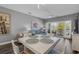 Open-concept living and dining area with access to a private balcony, bright and inviting at 1001 World Tour Blvd. # 203, Myrtle Beach, SC 29579