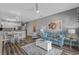 Cozy living room featuring a striped sofa, coastal decor, and a stylish coffee table with game at 1001 World Tour Blvd. # 203, Myrtle Beach, SC 29579