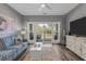 Cozy living room featuring comfortable seating, a view of the outdoor greenery, and plenty of natural light at 1001 World Tour Blvd. # 203, Myrtle Beach, SC 29579