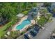 Aerial view of the community pool with lounge chairs and shaded tables at 1001 World Tour Blvd. # 203, Myrtle Beach, SC 29579