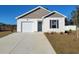 Charming one-story home with a well-maintained lawn and an attached garage, offering comfortable suburban living at 1009 Garden Sprout Dr, Galivants Ferry, SC 29544
