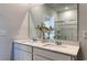 Bright bathroom featuring double sinks, quartz countertop, white cabinets, a large mirror and a shower at 1014 Laconic Dr., Myrtle Beach, SC 29588