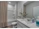 Bathroom featuring a tub-shower combo, white vanity, and elegant decor at 1014 Laconic Dr., Myrtle Beach, SC 29588
