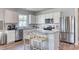 Modern kitchen featuring white cabinets, stainless steel appliances, and a granite island at 1014 Laconic Dr., Myrtle Beach, SC 29588