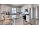 Modern kitchen featuring white cabinets, stainless steel appliances, and a granite island at 1014 Laconic Dr., Myrtle Beach, SC 29588