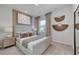 Serene main bedroom featuring neutral tones, soft carpet, and decorative wall accents at 1014 Laconic Dr., Myrtle Beach, SC 29588