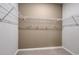 Empty walk-in closet with white wire shelving and neutral colored walls, ready for organization at 1014 Laconic Dr., Myrtle Beach, SC 29588
