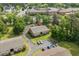 Aerial view of brick apartment buildings with parking in a green, tree-filled complex at 1015 Elm St. # 4, Conway, SC 29526