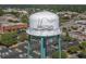 An aerial view of a quaint town with a painted water tower, surrounding buildings, and parking lot at 1015 Elm St. # 4, Conway, SC 29526