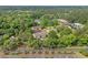 Overhead view of an apartment complex surrounded by green foliage and a nearby road at 1015 Elm St. # 4, Conway, SC 29526
