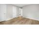 Spacious bedroom featuring neutral paint, light wood floors, and three doors at 1015 Elm St. # 4, Conway, SC 29526