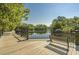 A waterfront deck with a bench that overlooks a scenic river and lush trees at 1015 Elm St. # 4, Conway, SC 29526