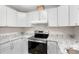Modern kitchen featuring white cabinets, granite countertops, and stainless steel appliances at 1015 Elm St. # 4, Conway, SC 29526