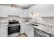 Bright kitchen featuring white cabinets, granite countertops, and stainless steel appliances at 1015 Elm St. # 4, Conway, SC 29526