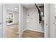 Laundry room with a utility closet, a window with a view, and light wood floors at 1015 Elm St. # 4, Conway, SC 29526
