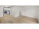 Open floor plan with wood-look flooring, seamlessly connecting the living space to the kitchen at 1015 Elm St. # 4, Conway, SC 29526