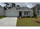 Charming single-Gathering home featuring a two-car garage and well-maintained front lawn at 1019 Laconic Dr., Myrtle Beach, SC 29588