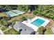 Aerial view showcases a community pool, tennis court, and playground surrounded by lush greenery at 10301 N Kings Hwy. # 10-4, Myrtle Beach, SC 29572