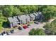 Aerial view of townhomes surrounded by lush landscaping and ample parking at 10301 N Kings Hwy. # 10-4, Myrtle Beach, SC 29572