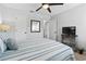 Bright bedroom featuring a ceiling fan and a television at 10301 N Kings Hwy. # 10-4, Myrtle Beach, SC 29572