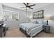 Comfortable bedroom featuring a ceiling fan and a bright window at 10301 N Kings Hwy. # 10-4, Myrtle Beach, SC 29572