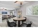 Bright dining area with neutral walls and a stylish table setting, offering a comfortable place to eat at 10301 N Kings Hwy. # 10-4, Myrtle Beach, SC 29572