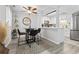 Cozy dining area next to the kitchen, perfect for enjoying casual meals with Gathering and friends at 10301 N Kings Hwy. # 10-4, Myrtle Beach, SC 29572