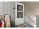 Inviting entryway featuring a white screen door and neutral-colored siding, creating a welcoming entrance at 10301 N Kings Hwy. # 10-4, Myrtle Beach, SC 29572