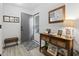 Welcoming foyer features stylish console table and mirror, offering a glimpse into a well-decorated home at 10301 N Kings Hwy. # 10-4, Myrtle Beach, SC 29572