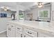 Open concept kitchen area with marble countertops and views to the outside patio at 10301 N Kings Hwy. # 10-4, Myrtle Beach, SC 29572