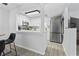 Modern kitchen with white cabinets, stainless steel appliances, and stylish backsplash, ideal for cooking at 10301 N Kings Hwy. # 10-4, Myrtle Beach, SC 29572