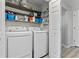 Well-organized laundry room with front load washer, dryer, and ample storage shelves at 10301 N Kings Hwy. # 10-4, Myrtle Beach, SC 29572