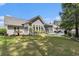 Lush backyard with a patio, green lawn, and attractive landscaping enhancing the outdoor living space at 1105 Lampwick Ln., Murrells Inlet, SC 29576