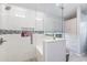 Modern bathroom showcasing a glass shower with a built-in bench and tiled walls and storage at 1105 Lampwick Ln., Murrells Inlet, SC 29576